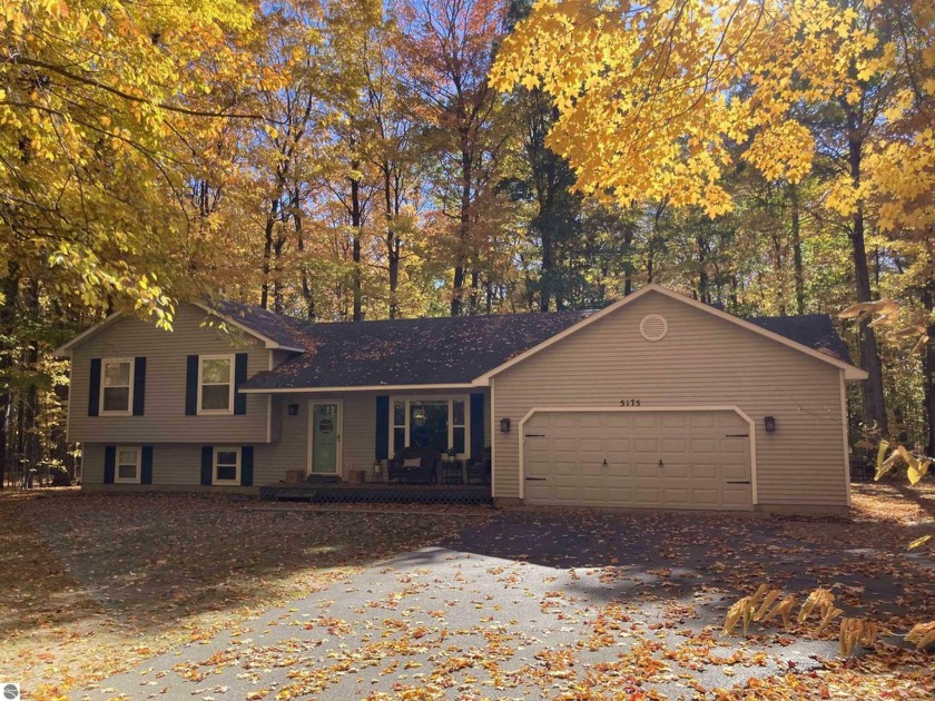 4br, 2ba quad level on 1.6 beautifully wooded acres in Long Lake - Beach Home for sale in Traverse City, Michigan on Beachhouse.com