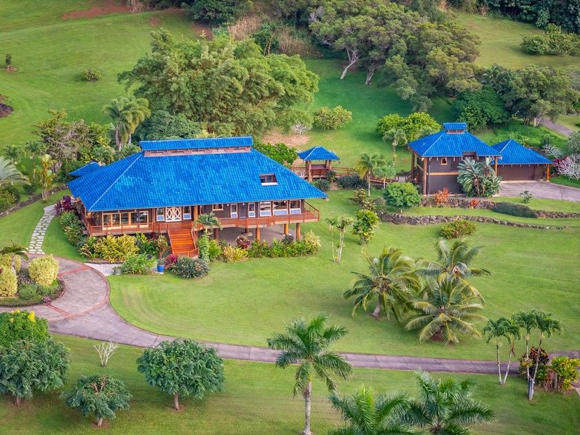 Nestled against the Nounou Forest Reserve, this exceptional 2 - Beach Home for sale in Kapaa, Hawaii on Beachhouse.com