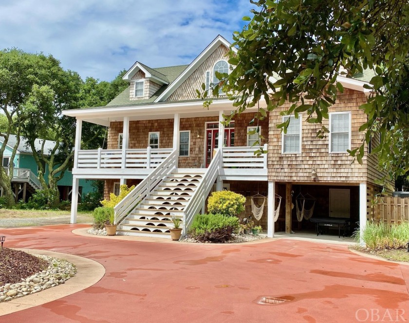 Nestled among the mature live oaks, this one is truly a hidden - Beach Home for sale in Southern Shores, North Carolina on Beachhouse.com