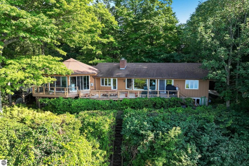 Nestled high among the woods, this lovely residence offers - Beach Home for sale in Frankfort, Michigan on Beachhouse.com