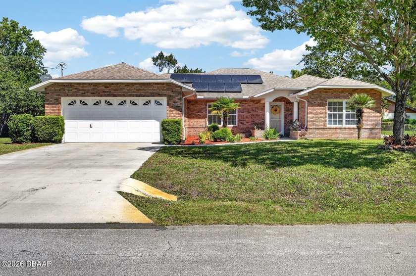 Minutes from Pine Lakes Golf Club, this move-in ready home - Beach Home for sale in Palm Coast, Florida on Beachhouse.com