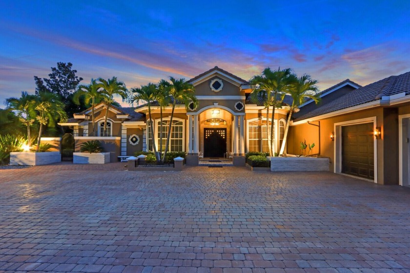 STUNNING, CUSTOM DESIGNED RESIDENCE, PERFECTLY SITUATED ON A 1/2 - Beach Home for sale in Port Saint Lucie, Florida on Beachhouse.com