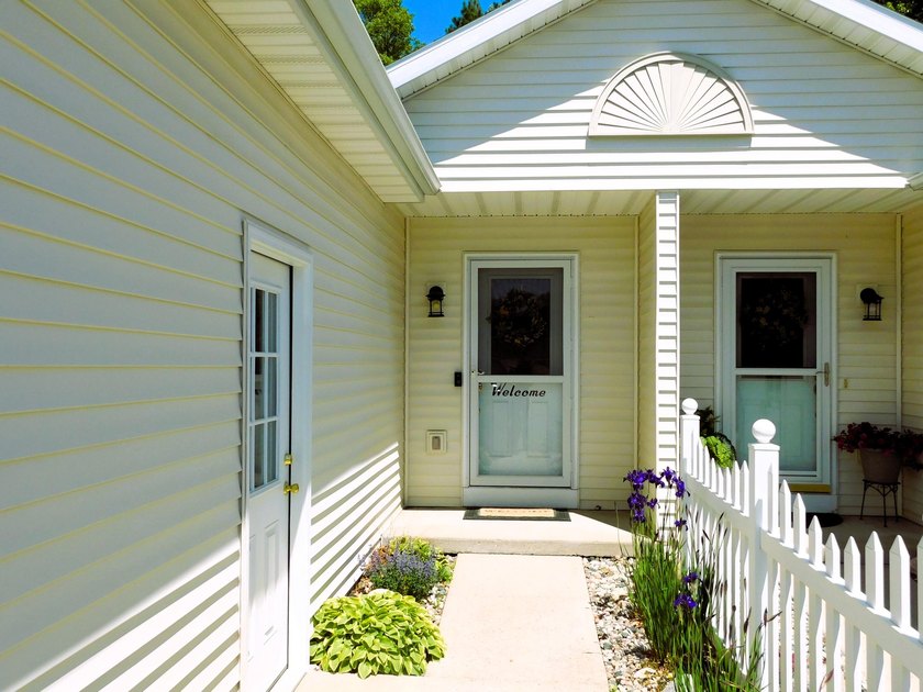 Nestled on a quiet cul-de-sac, this exceptional condo offers - Beach Condo for sale in Manistee, Michigan on Beachhouse.com