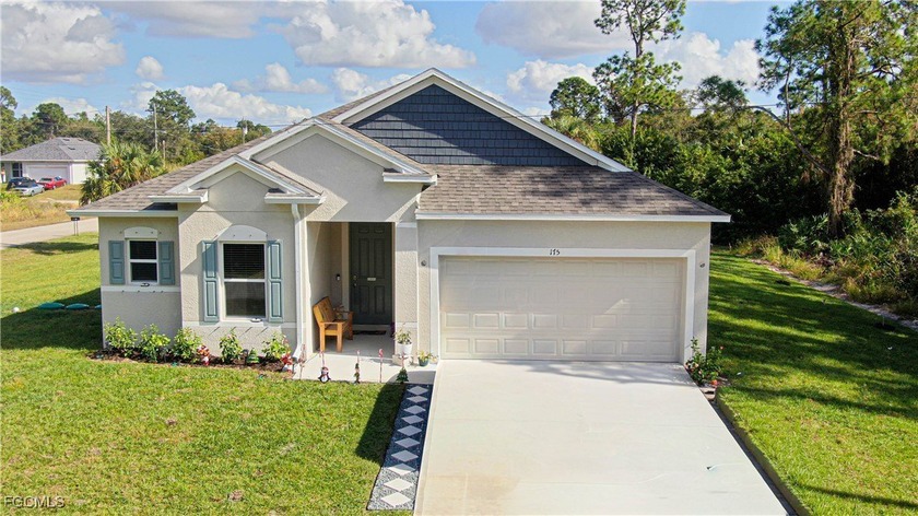 Welcome to this stunning corner-lot home in Lehigh Acres located - Beach Home for sale in Lehigh Acres, Florida on Beachhouse.com