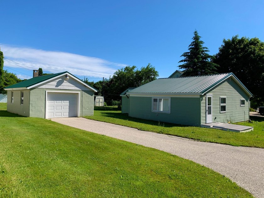 This cute little house sits on a large lot in town and has a - Beach Home for sale in Saint Ignace, Michigan on Beachhouse.com