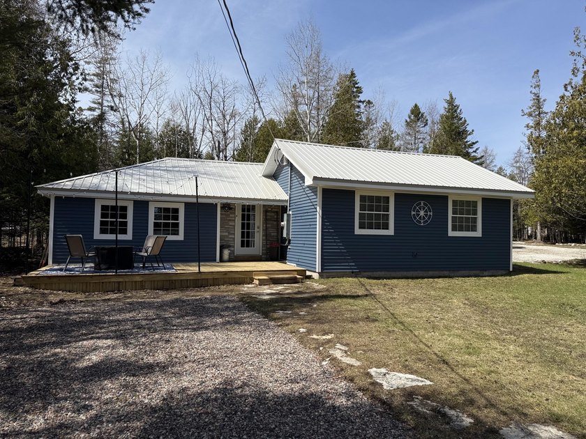 Discover this completely transformed year-round home along - Beach Home for sale in Cedarville, Michigan on Beachhouse.com