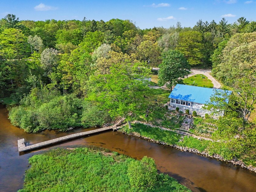 This stunning Big Sable Riverfront home presents a unique - Beach Home for sale in Free Soil, Michigan on Beachhouse.com