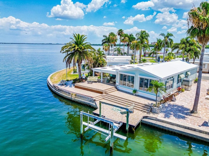 Experience the ultimate in waterfront living with this exquisite - Beach Home for sale in Clearwater, Florida on Beachhouse.com