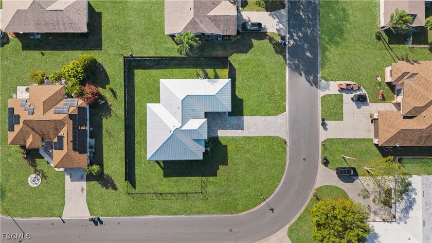 CITY WATER | HUGE OVERSIZED CORNER LOT featuring a stunning - Beach Home for sale in Lehigh Acres, Florida on Beachhouse.com