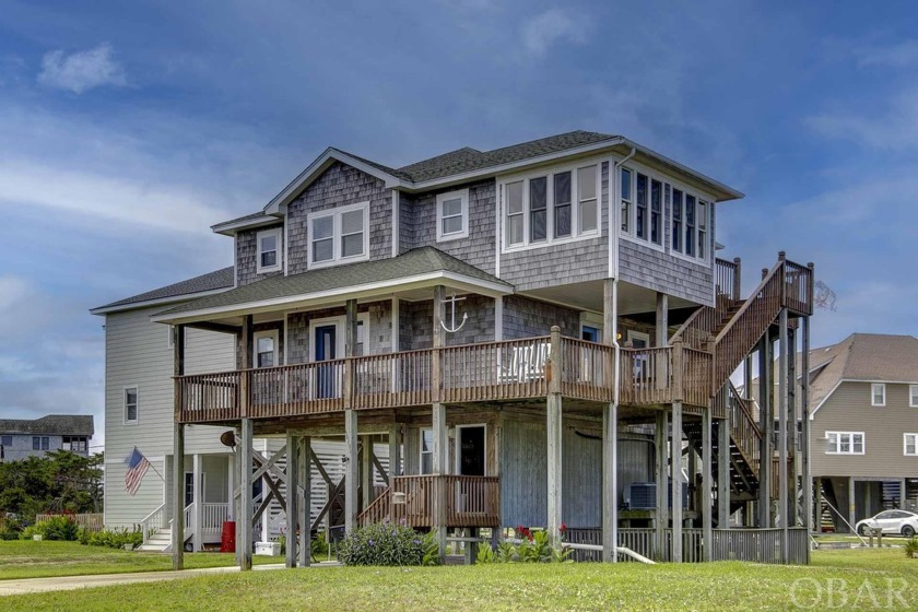 This canal front home in Brigands Bay has been improved and - Beach Home for sale in Frisco, North Carolina on Beachhouse.com
