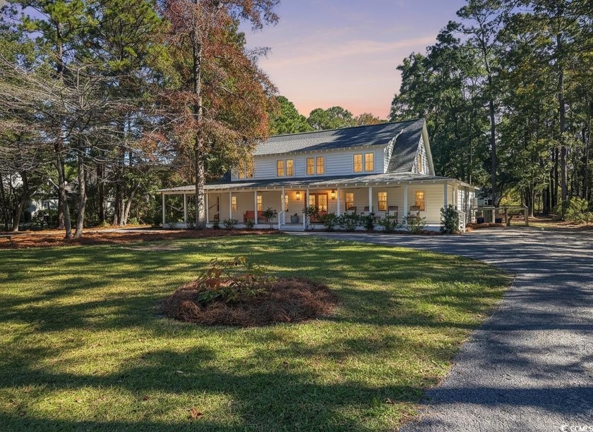 Discover rare privacy at 83 Hammock Ave. Set on a private - Beach Home for sale in Pawleys Island, South Carolina on Beachhouse.com