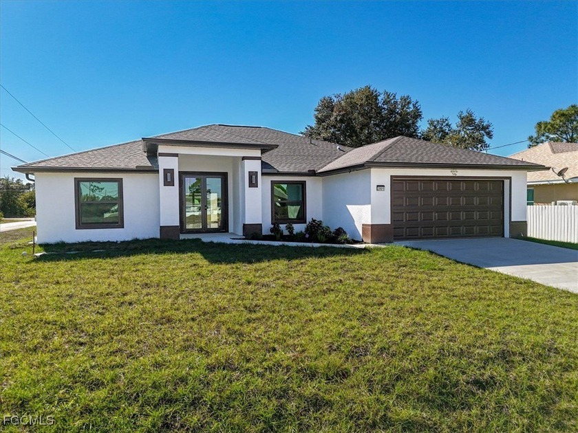 STUNNING NEW HOME on a prime corner lot. Featuring 4 spacious - Beach Home for sale in Lehigh Acres, Florida on Beachhouse.com