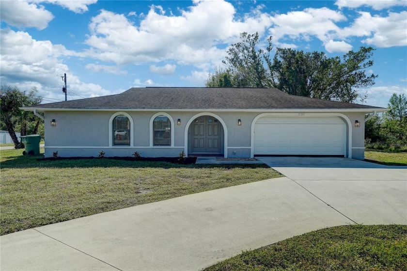 Welcome to this beautifully updated home situated on a large - Beach Home for sale in Port Charlotte, Florida on Beachhouse.com