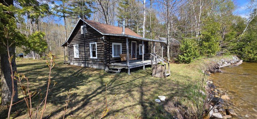 Experience historic charm with 190ft of sandy-bottom frontage on - Beach Home for sale in De Tour Village, Michigan on Beachhouse.com
