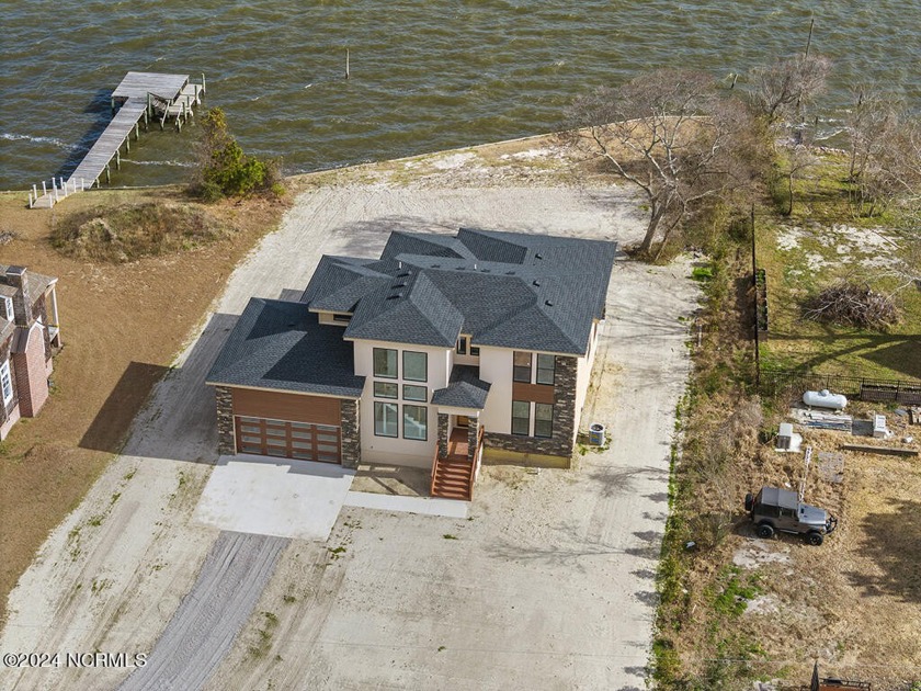 Welcome to a showcase of modern elegance! This waterfront, 4 bed - Beach Home for sale in Aydlett, North Carolina on Beachhouse.com