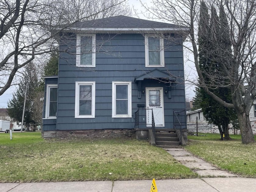 Situated directly across from the LSSU Center for Freshwater - Beach Home for sale in Sault Sainte Marie, Michigan on Beachhouse.com