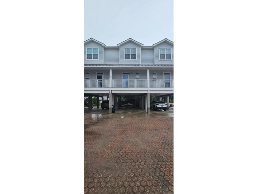 Park your boat in your own slip with a lift.! Two bedroom, 2 1/2 - Beach Townhome/Townhouse for sale in Carabelle, Florida on Beachhouse.com