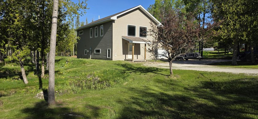 Discover your own private oasis on this spacious 1.8-acre triple - Beach Home for sale in Cedarville, Michigan on Beachhouse.com