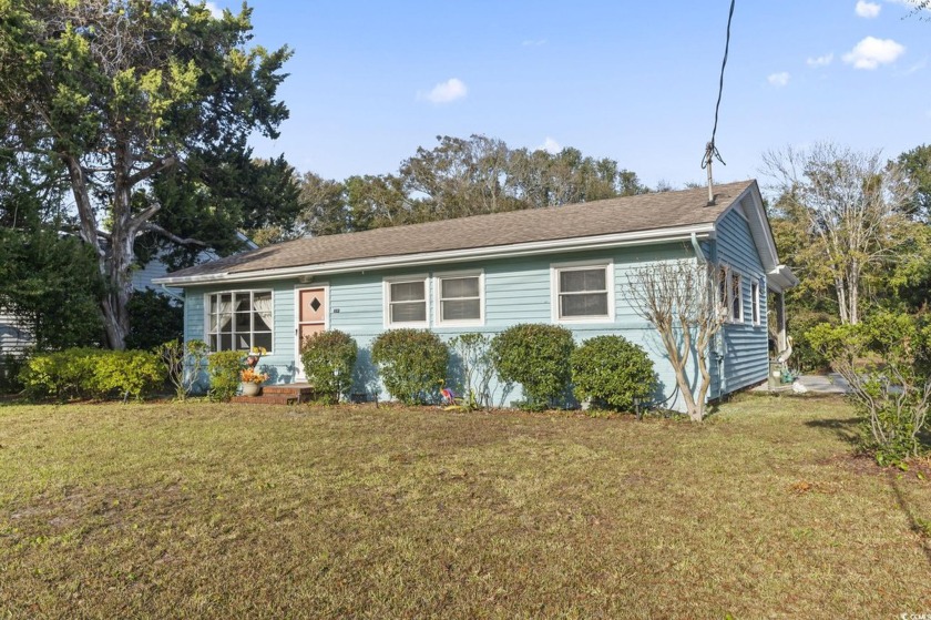 Located just a short stroll from the beach, this delightful - Beach Home for sale in Surfside Beach, South Carolina on Beachhouse.com