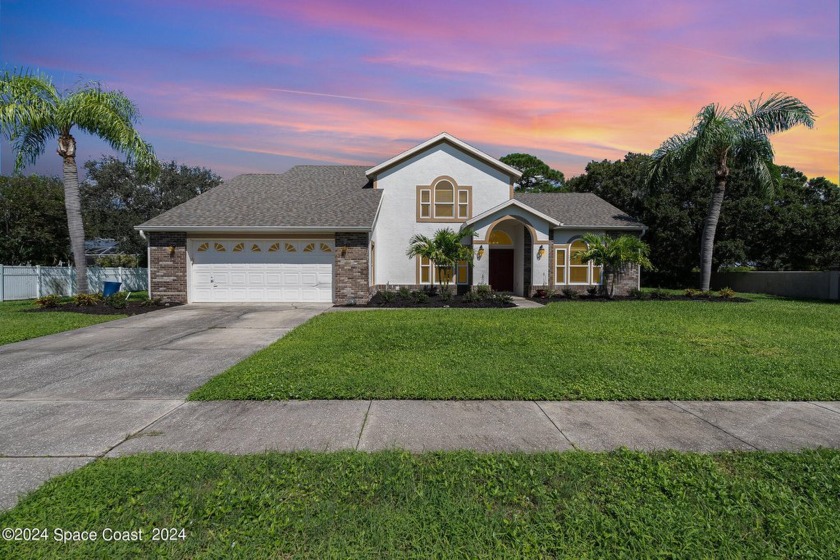 Welcome to this light and bright spacious four-bedroom home in a - Beach Home for sale in Merritt Island, Florida on Beachhouse.com