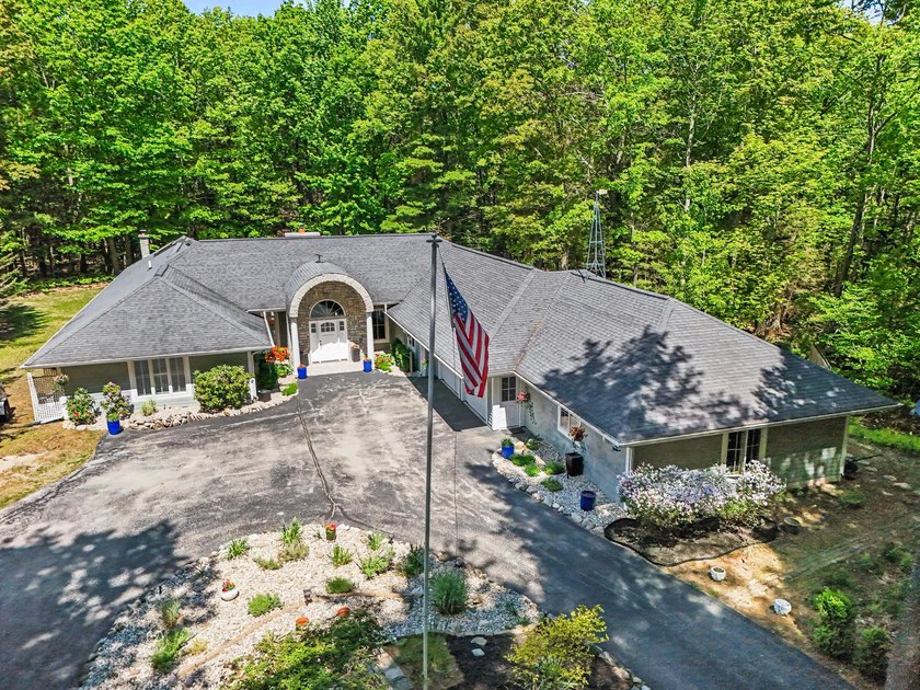 This extraordinary coastal estate offers 275 feet of exclusive - Beach Home for sale in Pentwater, Michigan on Beachhouse.com