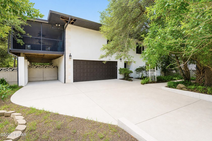 Tucked beneath mature oak trees on one of Ormond-by-the-Sea's - Beach Home for sale in Ormond Beach, Florida on Beachhouse.com
