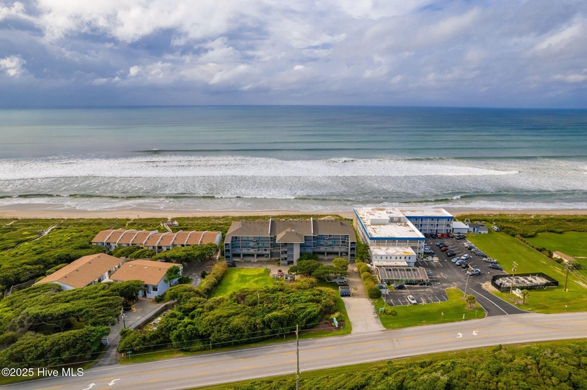 Experience breathtaking ocean views the moment you enter this - Beach Condo for sale in Pine Knoll Shores, North Carolina on Beachhouse.com