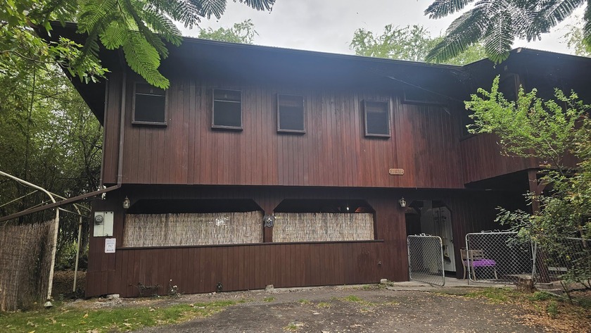 This quality-built redwood home is located in Napo'opo'o Village - Beach Home for sale in Captain Cook, Hawaii on Beachhouse.com