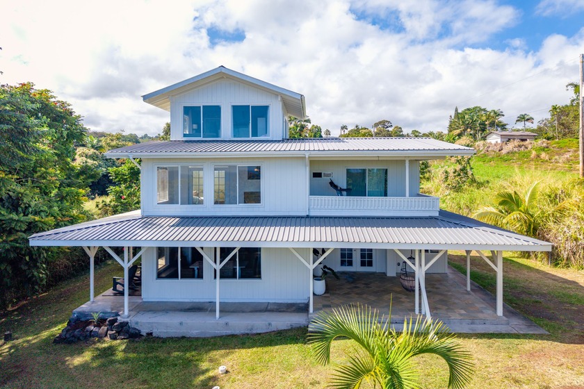 Nestled on 1.33 acres, this custom 3-bedroom, 3-bath home offers - Beach Home for sale in Papaikou, Hawaii on Beachhouse.com