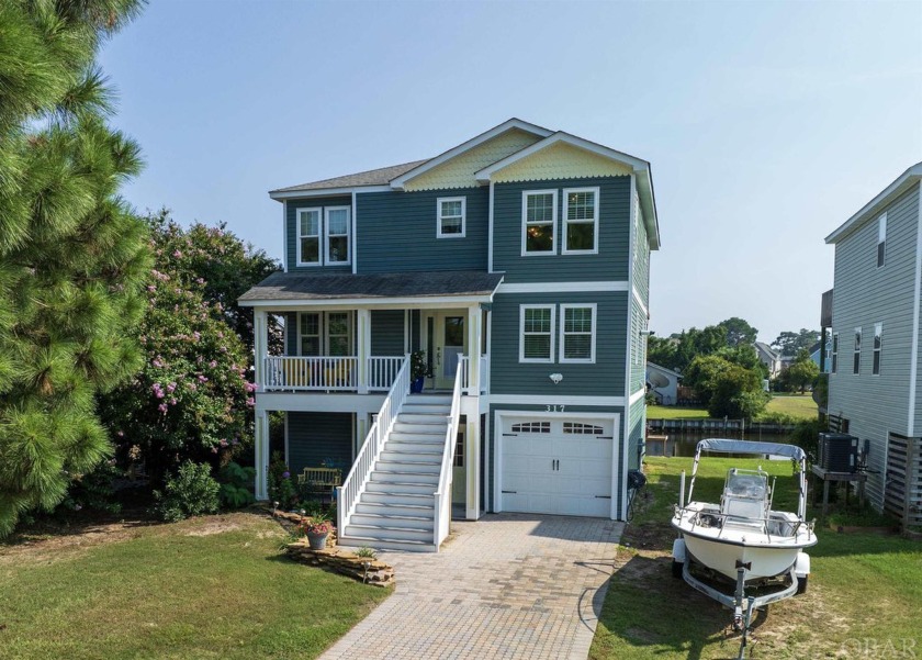 Experience carefree canal-front living in Colington Harbour with - Beach Home for sale in Kill Devil Hills, North Carolina on Beachhouse.com