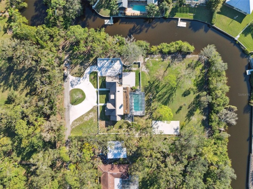 Secluded at the end of a peaceful road, this exceptional 1 - Beach Home for sale in Clearwater, Florida on Beachhouse.com