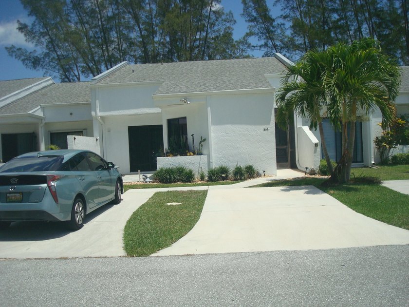 Spacious 3 bedroom villa on canal with fabulous view of golf - Beach Home for sale in Royal Palm Beach, Florida on Beachhouse.com