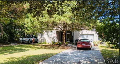 A quaint three bedroom two bath cottage, nestled under live oak - Beach Home for sale in Kill Devil Hills, North Carolina on Beachhouse.com