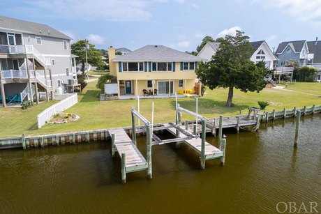 Experience the ultimate in canal-front living with this lovingly - Beach Home for sale in Kill Devil Hills, North Carolina on Beachhouse.com