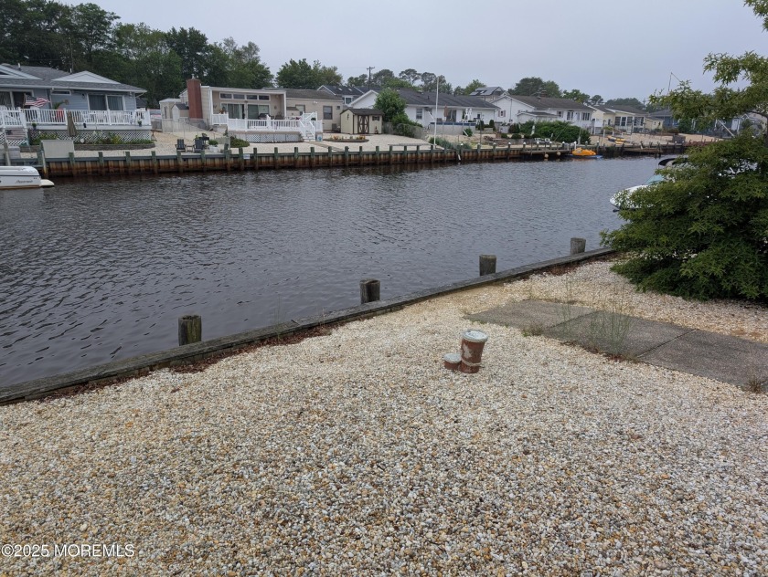 AFFORDABLE HOME ON A LAGOON. * WALKING DISTANCE TO WAWA AND - Beach Home for sale in Forked River, New Jersey on Beachhouse.com