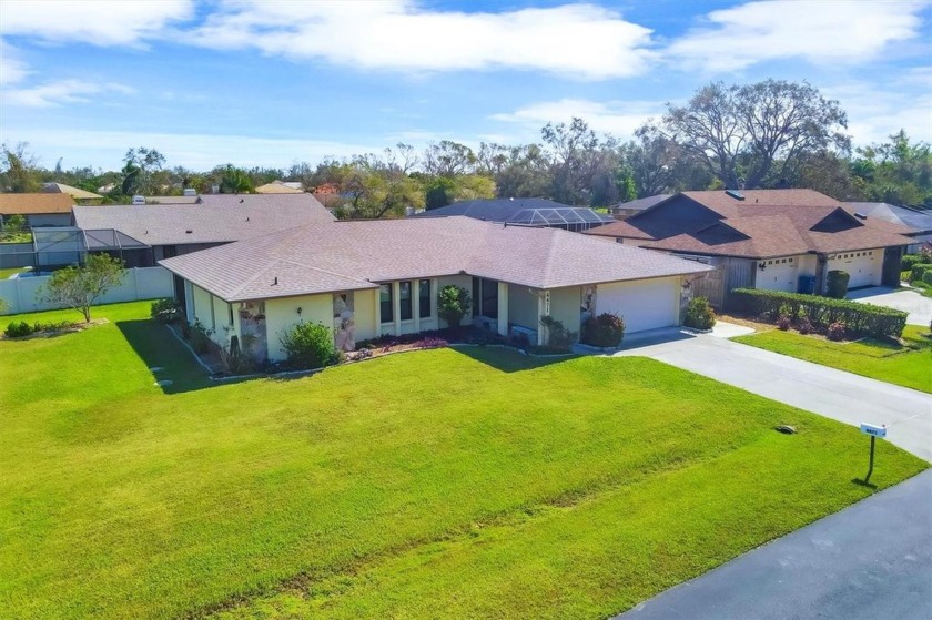 Welcome to this well-designed 3-bedroom, 2-bathroom home in - Beach Home for sale in Sarasota, Florida on Beachhouse.com