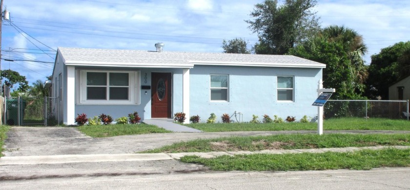 BEAUTIFULLY REMODELED 3 BEDROOM SINGLE FAMILY HOME WITHIN - Beach Home for sale in Riviera Beach, Florida on Beachhouse.com