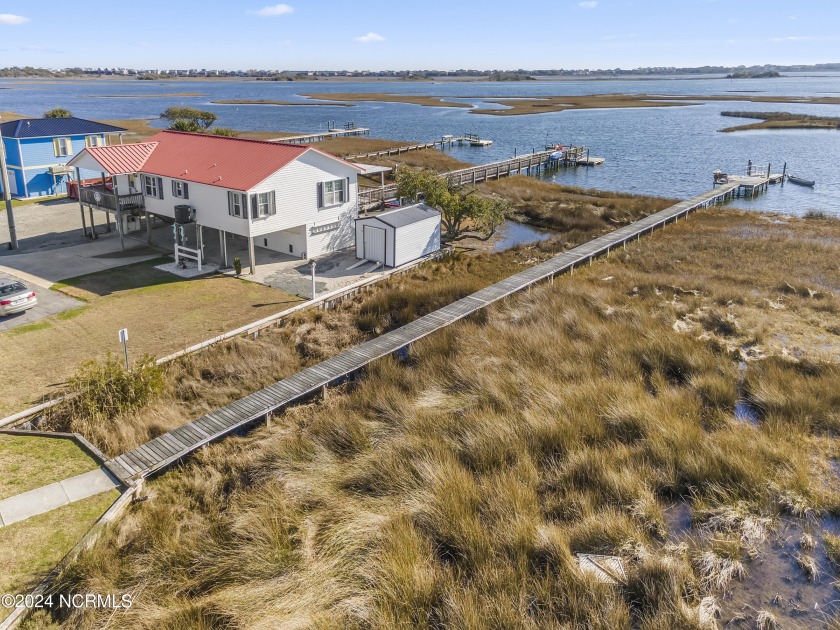 Experience paradise living at its peak in this exquisite - Beach Home for sale in Surf City, North Carolina on Beachhouse.com