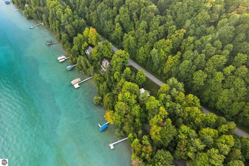 Tucked away on the sparkling edge of Torch Lake, one of the most - Beach Lot for sale in Kewadin, Michigan on Beachhouse.com