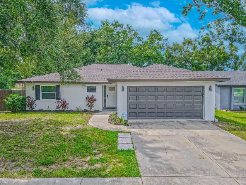 Welcome to this beautifully updated 3-bedroom, 2-bath home in - Beach Home for sale in Palm Harbor, Florida on Beachhouse.com