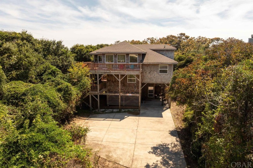 This charming 4-bedroom, 2-bath oceanside home in sought-after - Beach Home for sale in Duck, North Carolina on Beachhouse.com