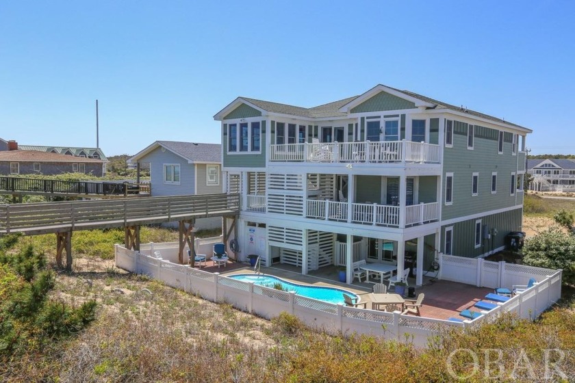 This stunning, custom-built home offers the ultimate coastal - Beach Home for sale in Southern Shores, North Carolina on Beachhouse.com