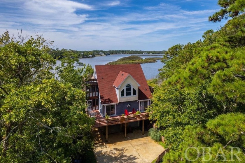 This SOUNDFRONT home with pier and over-water gazebo sits on - Beach Home for sale in Kill Devil Hills, North Carolina on Beachhouse.com