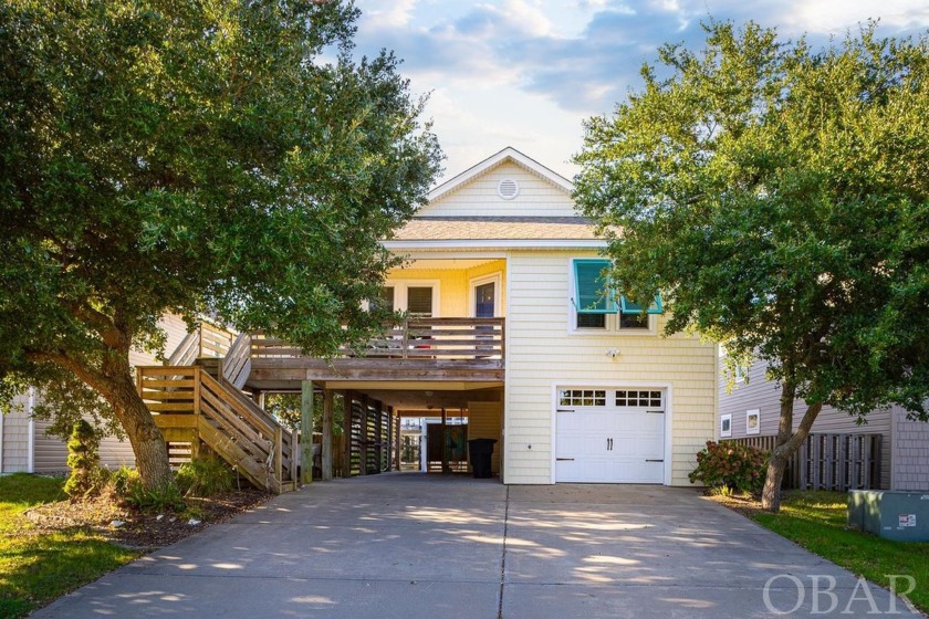 This stunning home boasts an ample amount of comfortable living - Beach Home for sale in Kill Devil Hills, North Carolina on Beachhouse.com