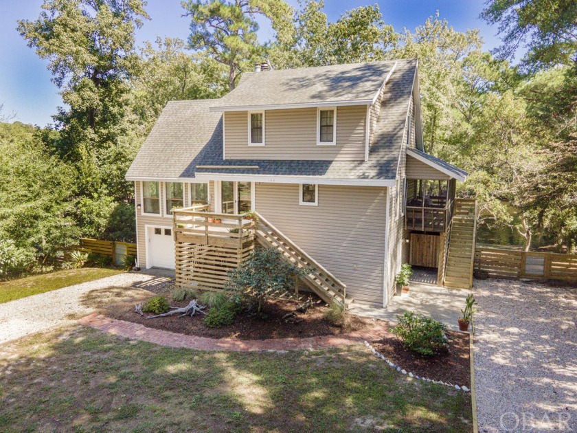 Nestled along the peaceful canals of Southern Shores, this - Beach Home for sale in Southern Shores, North Carolina on Beachhouse.com