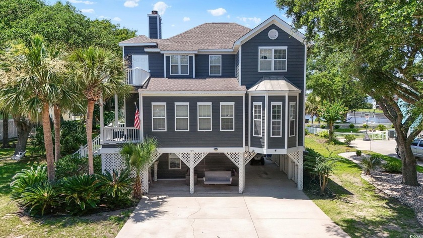 This spacious five-bedroom, four-bathroom raised beach home is - Beach Home for sale in Garden City Beach, South Carolina on Beachhouse.com
