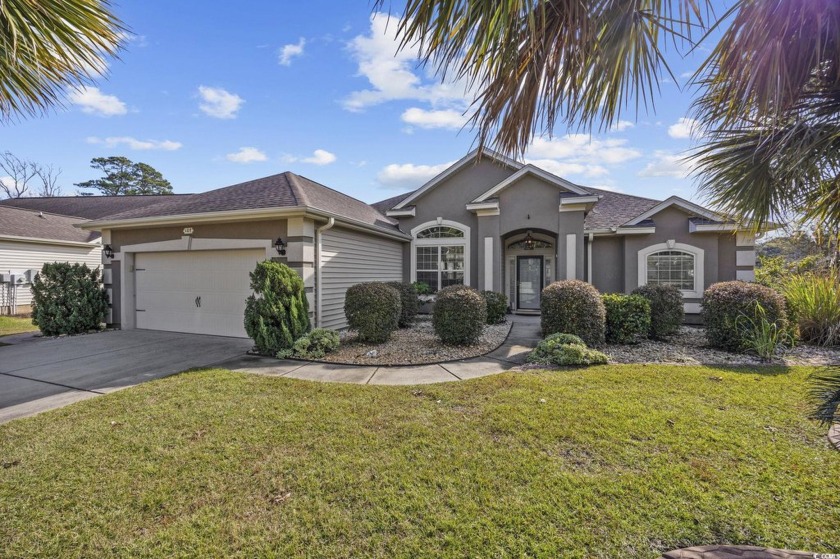 This stunning lakefront home, featuring 3 bedrooms and 2 baths - Beach Home for sale in Surfside Beach, South Carolina on Beachhouse.com