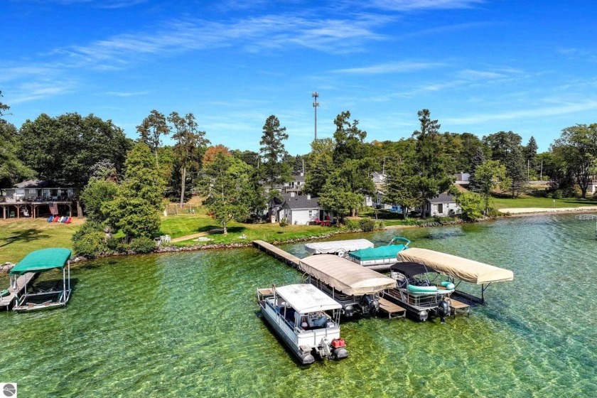 Meticulously Renovated Cottage on Elk Lake. Located at the north - Beach Condo for sale in Kewadin, Michigan on Beachhouse.com