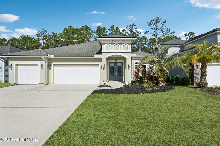 This rare, single-story, modern pool home in Eagle Nest Preserve - Beach Home for sale in Fleming Island, Florida on Beachhouse.com