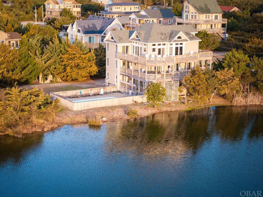 This idyllic setting is both lakefront and a short walk to the - Beach Home for sale in Waves, North Carolina on Beachhouse.com